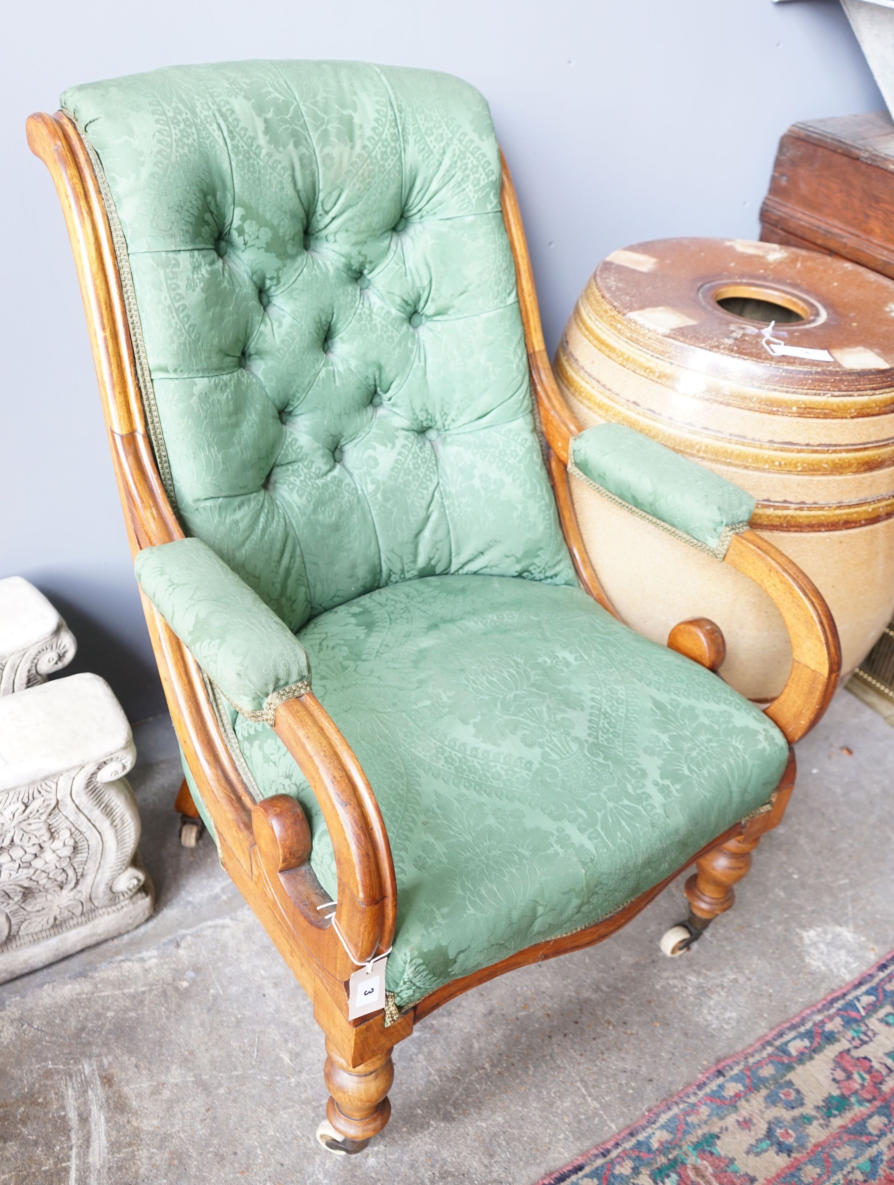 A Victorian mahogany green upholstered open armchair, width 66cm, depth 78cm, height 92cm